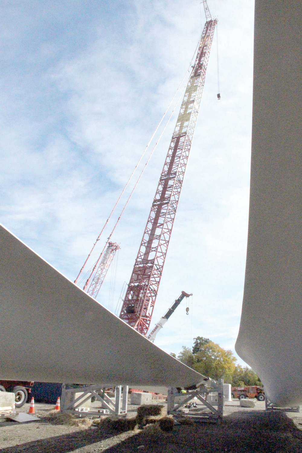 SKY HIGH: As seen from beneath the blades to power the turbine, a crane stands ready to lift tower components into place.
